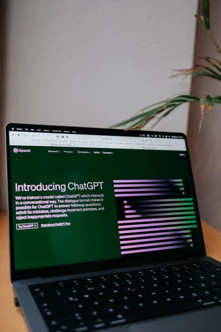A close-up view of a laptop displaying a search engine page.